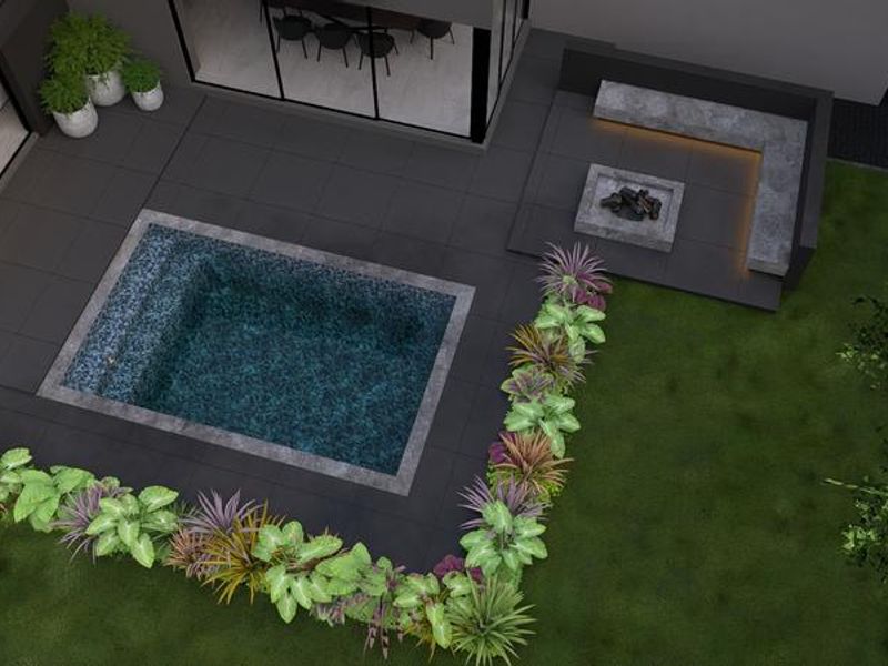 Aerial view of a modern outdoor entertainment area featuring a swimming pool, built-in fire pit with bench seating, and landscaped garden.