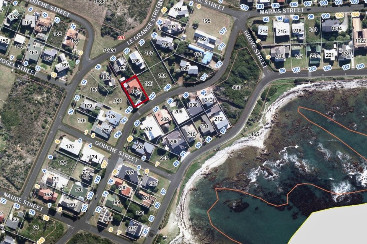 An aerial view showing the property location within the coastal residential neighbourhood, highlighting its proximity to the shoreline.