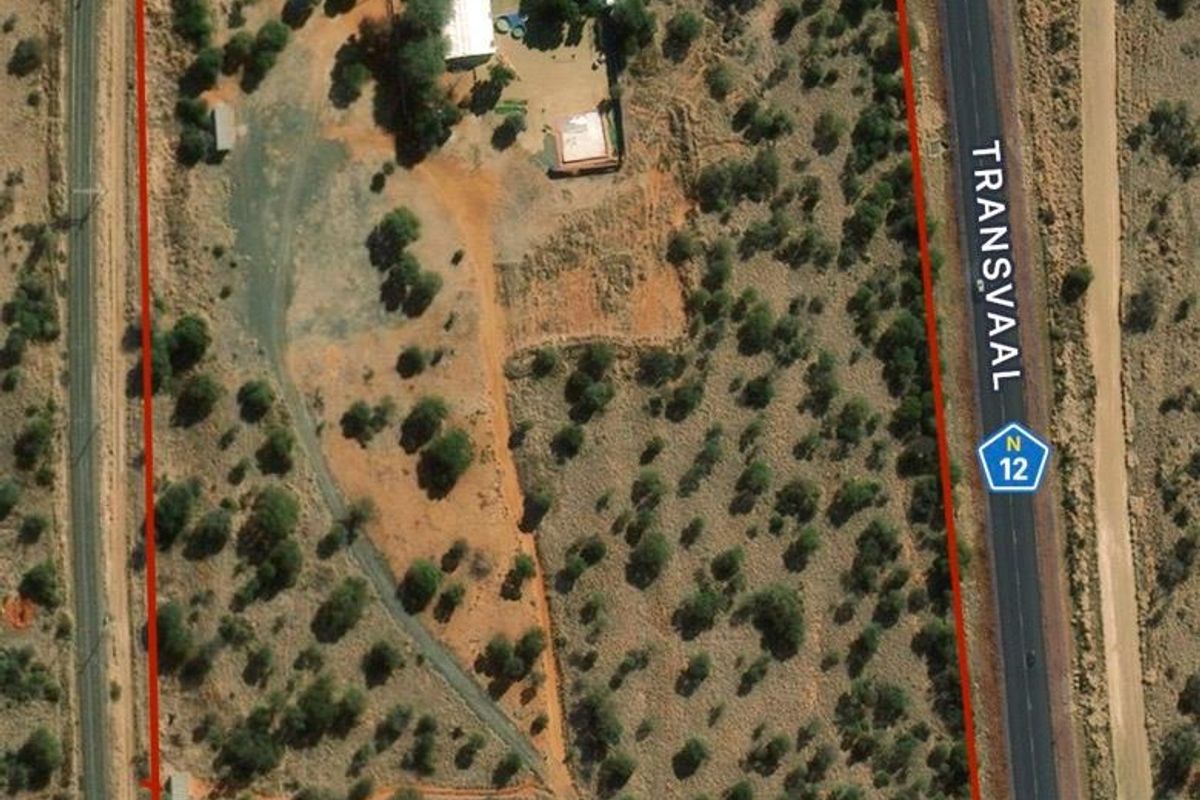 Aerial view of the farm property showing the main dwelling, outbuildings, and surrounding land boundaries adjacent to the N12 highway.