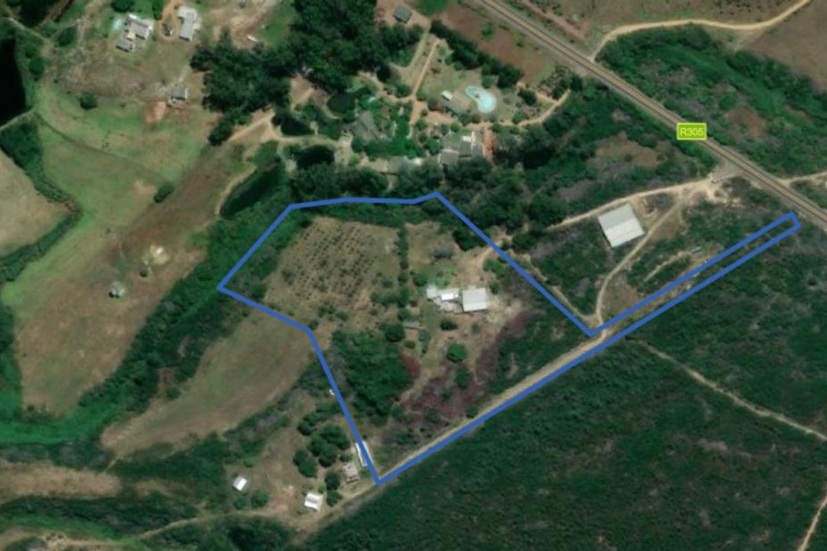 An aerial view of the farm property showing the land boundaries, existing structures, and surrounding landscape.