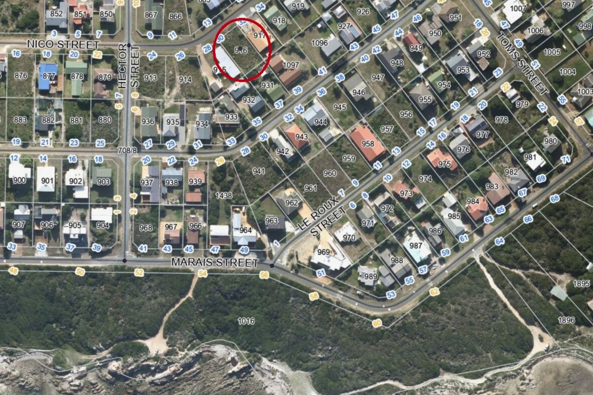 Aerial view of a residential vacant land plot in a developed coastal neighborhood, highlighting the property boundaries and surrounding street layout.