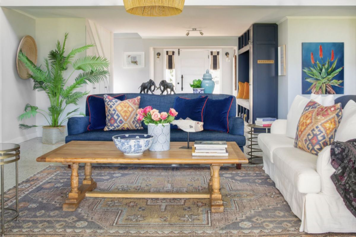 A bright and inviting living room featuring built-in cabinetry and a neutral color palette, creating a comfortable and well-maintained living space.