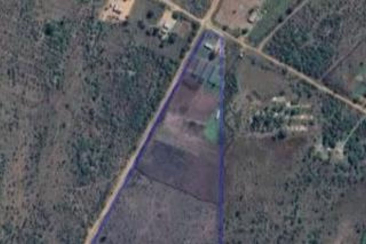 An aerial view of the farm property showing the land boundaries and surrounding rural landscape.