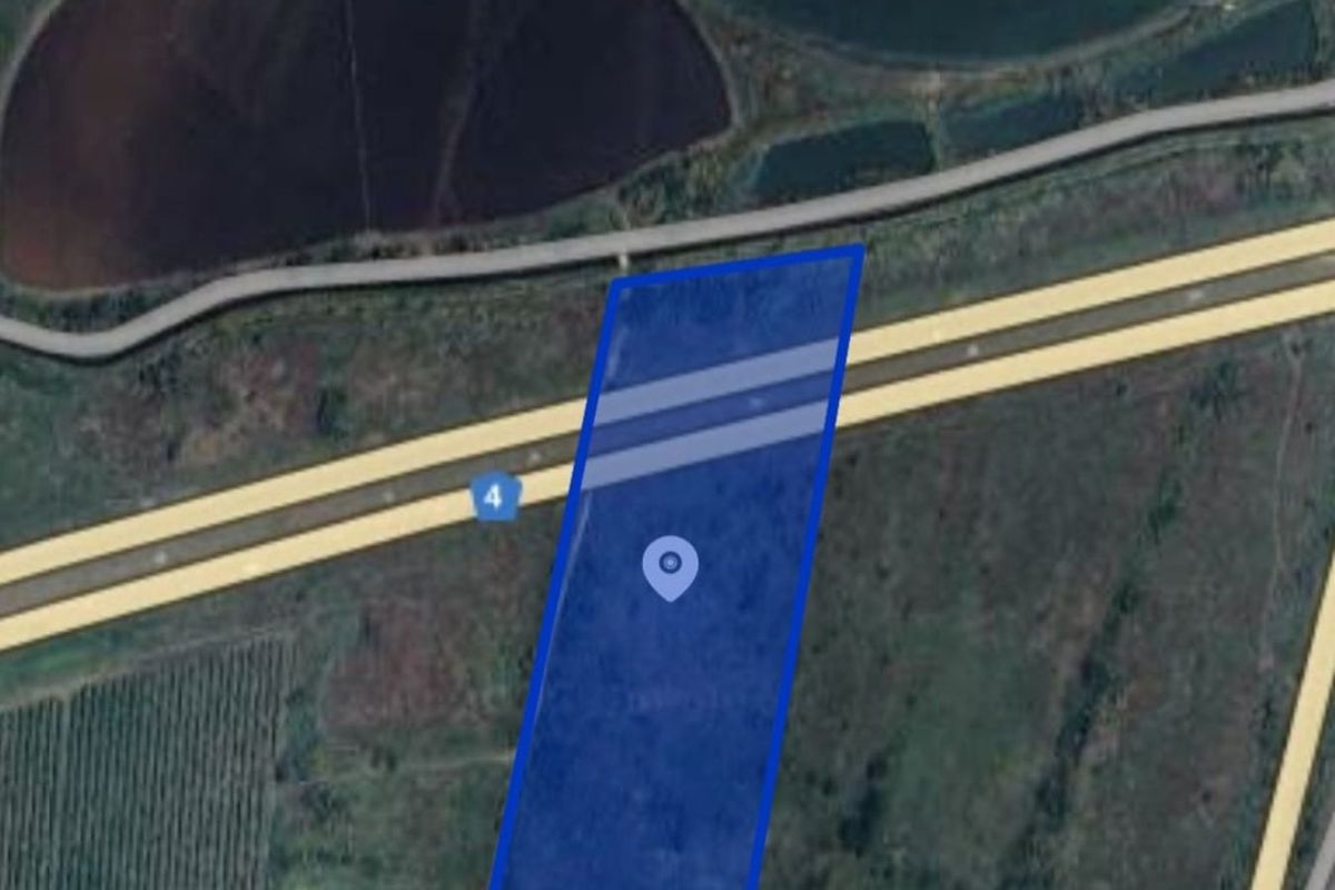 Aerial view of the farm property showing the land parcel boundaries and surrounding agricultural landscape.