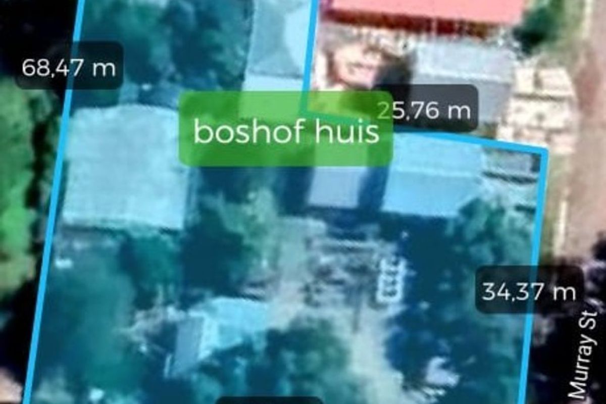 Aerial view of the property plot with boundary measurements and street access indicated.