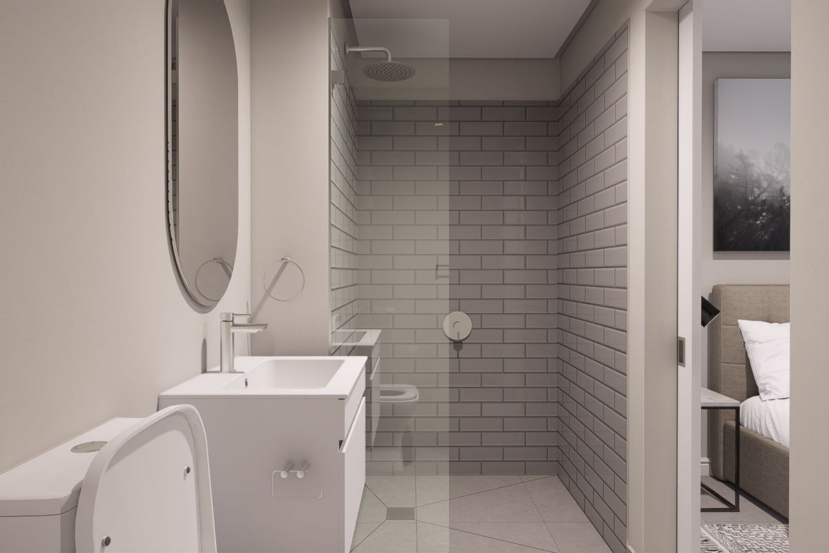 Modern bathroom featuring a walk-in shower with grey subway tiles, a sleek vanity with basin, and a wall-mounted mirror.