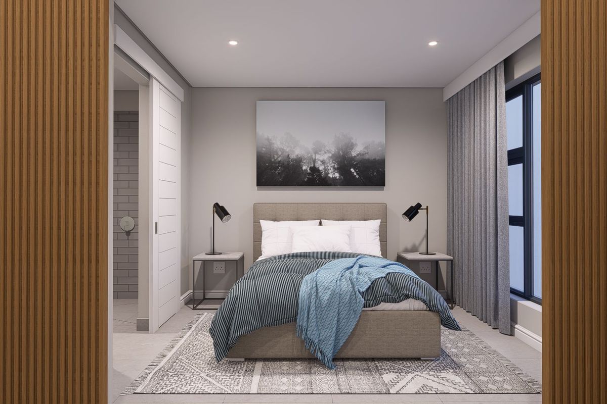 A modern, well-appointed bedroom featuring recessed lighting, a sliding door leading to an en-suite bathroom, and large windows with integrated curtain tracks.