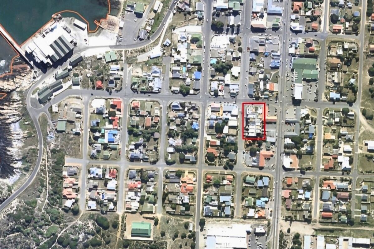 An aerial view of the coastal neighborhood showing the property location highlighted within the urban grid.