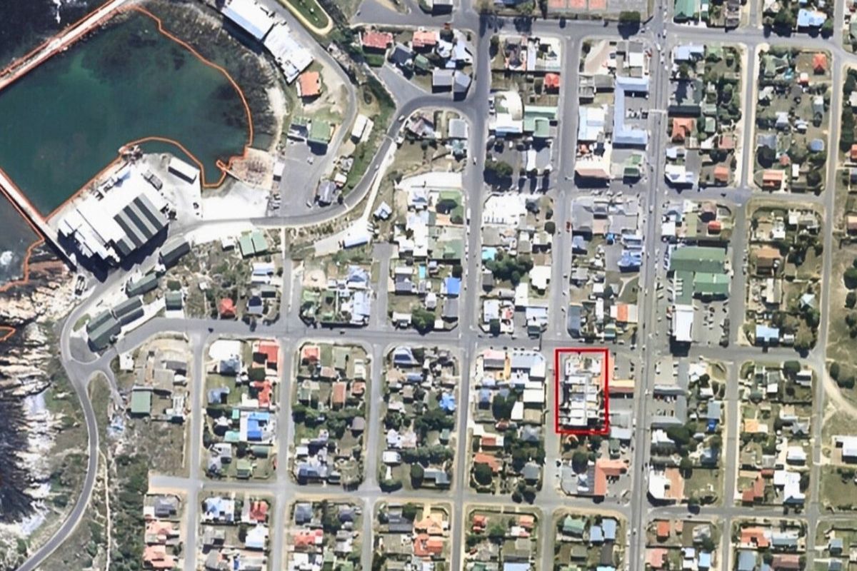 Aerial view of the coastal neighbourhood showing the property location highlighted within the urban grid.