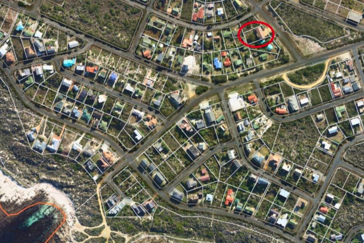 An aerial view of the residential neighborhood showing the property location highlighted within the coastal estate layout.