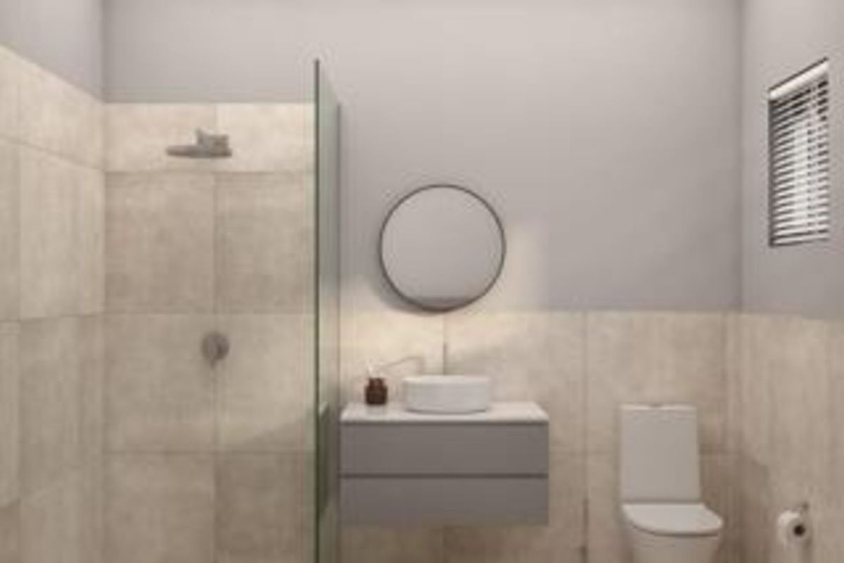 Modern bathroom featuring a floating vanity with a vessel sink, a glass-enclosed walk-in shower, and neutral wall tiling.