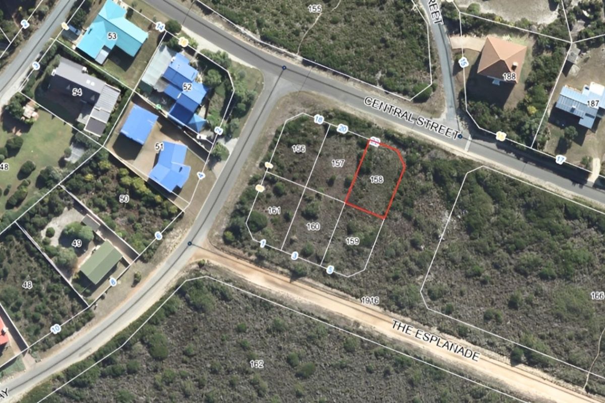 An aerial view of a vacant residential plot, identified as stand 158, situated in a coastal neighborhood with established road access.
