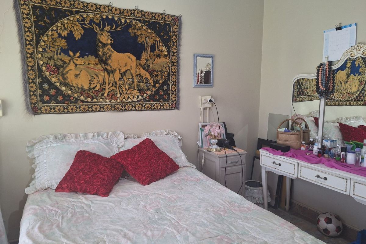 A bedroom featuring neutral wall tones and standard finishes, providing a functional space for rest.