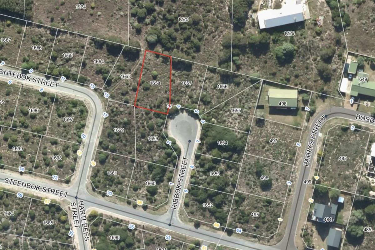 Aerial view of a vacant residential plot located in a quiet street, highlighting the property boundaries and surrounding neighborhood layout.