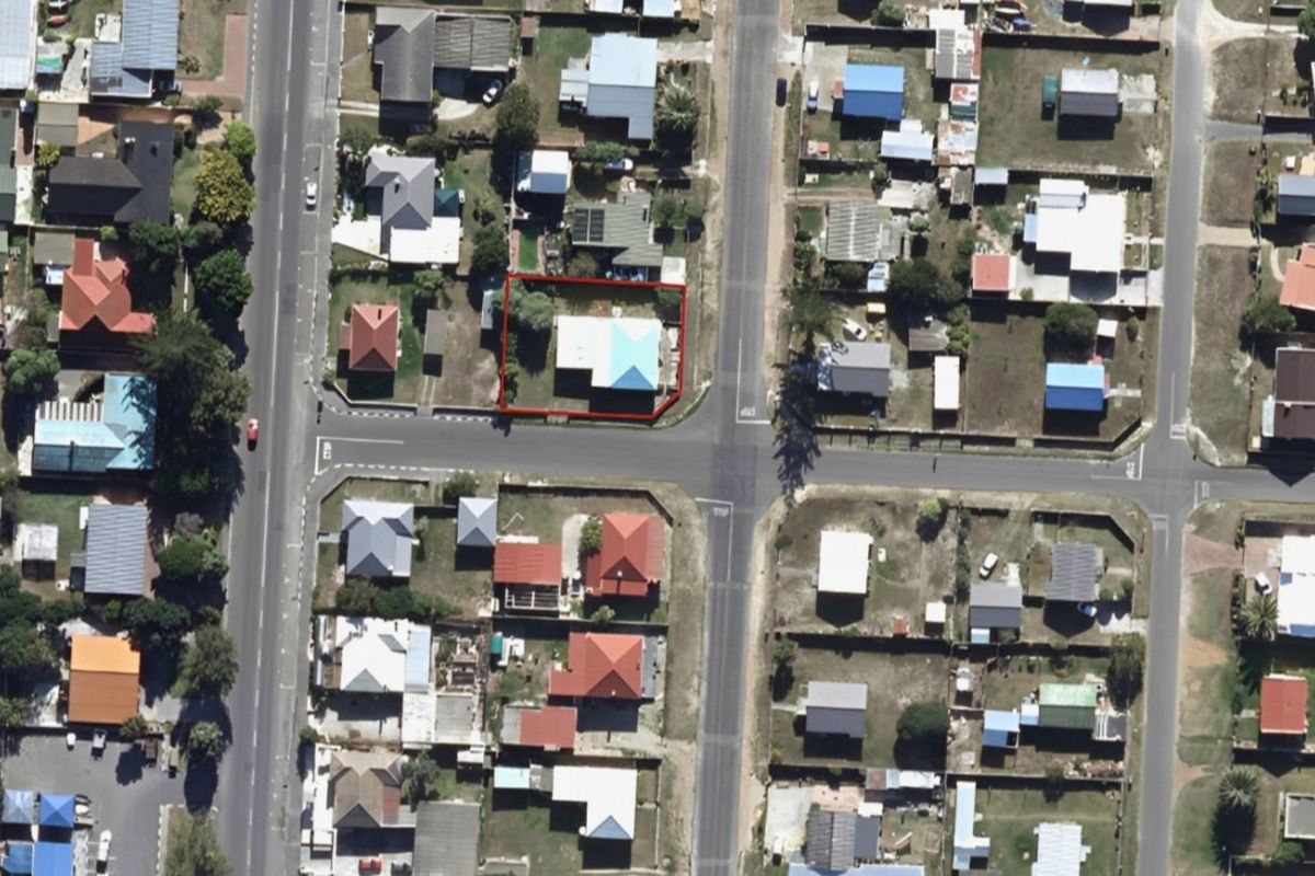 An aerial view of the property highlighting its corner lot position within the residential neighbourhood.