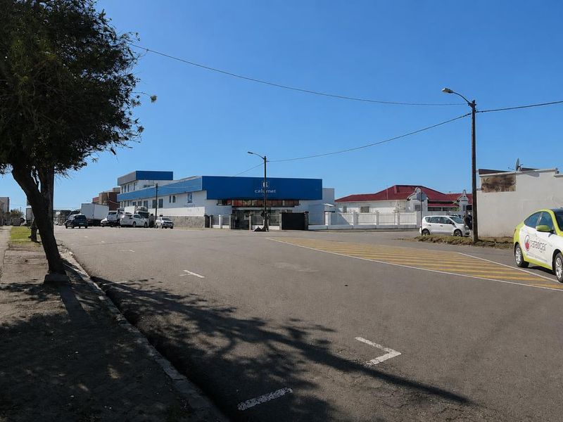 A street view showing the surrounding neighbourhood approach and road infrastructure near the property.