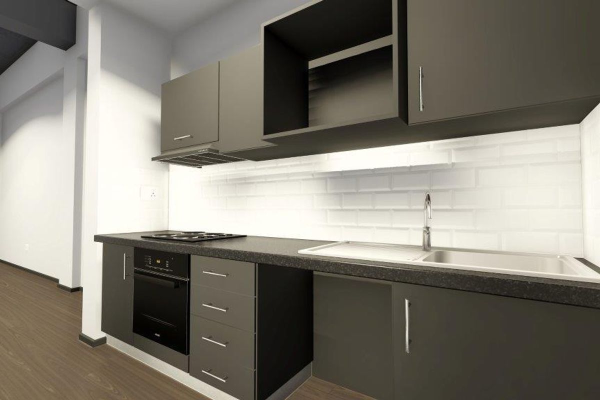 A modern, minimalist kitchen featuring dark cabinetry, a built-in oven, hob, extractor fan, and a clean white subway tile backsplash.