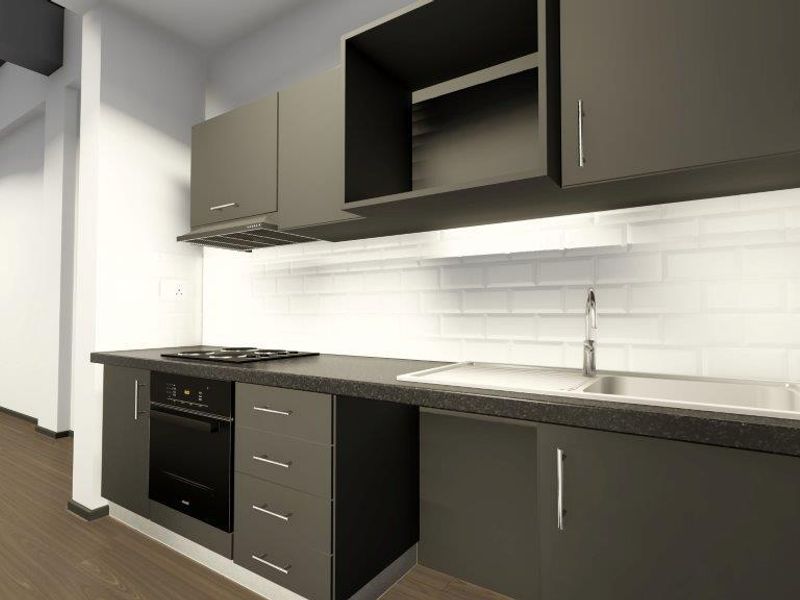 A modern, minimalist kitchen featuring dark cabinetry, a built-in oven, hob, extractor fan, and a clean white subway tile backsplash.
