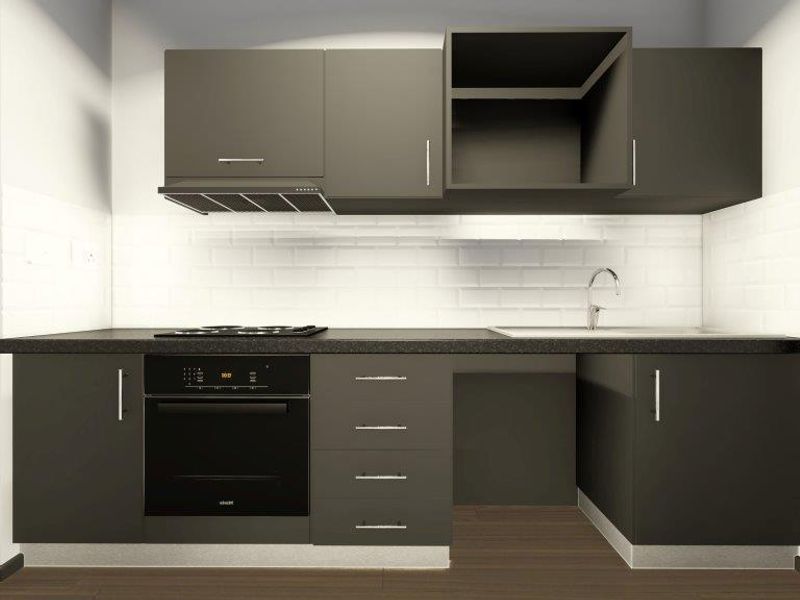 Modern kitchen featuring dark cabinetry, built-in oven, hob, extractor fan, and a clean subway tile backsplash with a stainless steel sink.