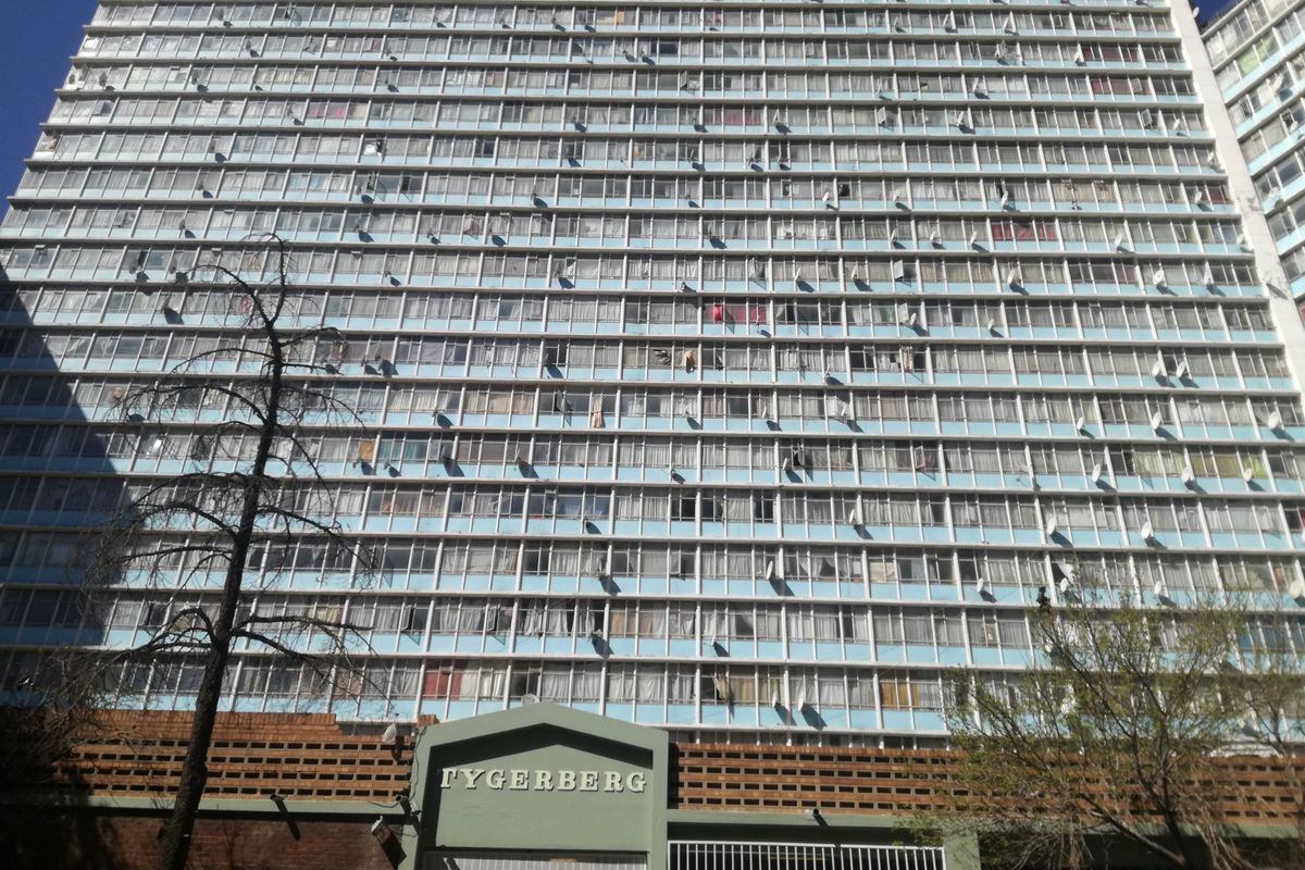 Front elevation view of the Tygerberg apartment building, showcasing the multi-story residential facade and ground-level security entrance.