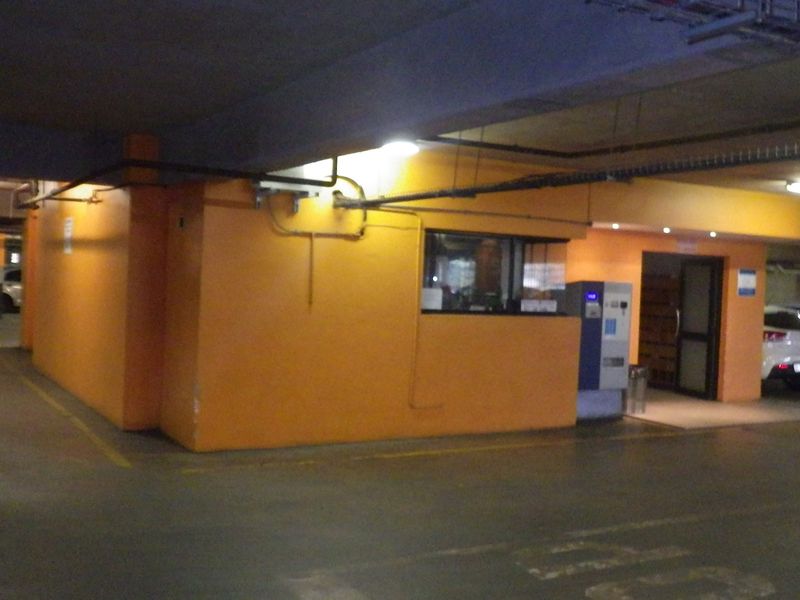 Underground parking garage facility featuring a dedicated security office and marked parking bays.